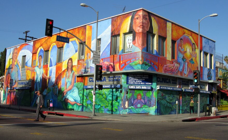 An iconic mural on Sunset Boulevard in Echo Park, L.A. -- a hilly, diverse, gentrifying neighborhood that was once a backlot for silent movies.