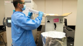 The UC San Diego Health Pharmacy team unpacks the first shipment of the Pfizer-BioNtech COVID-19 vaccine on Dec. 15, 2020.
