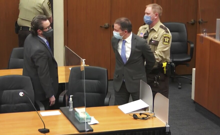 Former Minneapolis police Officer Derek Chauvin (center) is taken into custody as his attorney, Eric Nelson looks on, after the verdicts were read at Chauvin's trial for the 2020 death of George Floyd on Tuesday at the Hennepin County Courthouse in Minneapolis, Minn.