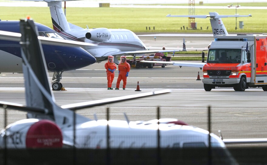 Medical personnel in hazmat suits wait for patients, evacuated from the MV Hondius cruise ship with suspected hantavirus infection, at Schiphol airport, Amsterdam, Netherlands, on Wednesday.
