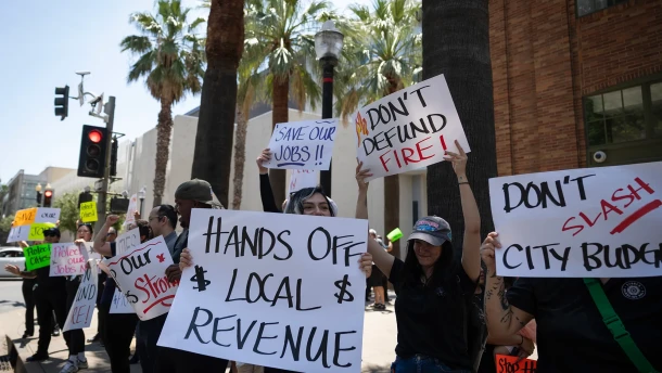 Protesters gather outside the Sheraton Grand Sacramento Hotel in Sacramento on May 21, 2026 to oppose regulations that would end black jack-style games at cardrooms across the state. The state’s cardroom industry recently sued Attorney General Rob Bonta to block the regulations. Bonta was speaking at a CalMatters-sponsored event at the hotel.