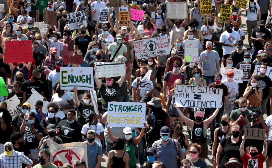 People march in support of Jacob Blake and his family to the Kenosha County Courthouse on August 29, 2020 in Kenosha, Wisconsin. Blake was shot seven times in the back in front of his three children by a police officer in Kenosha.