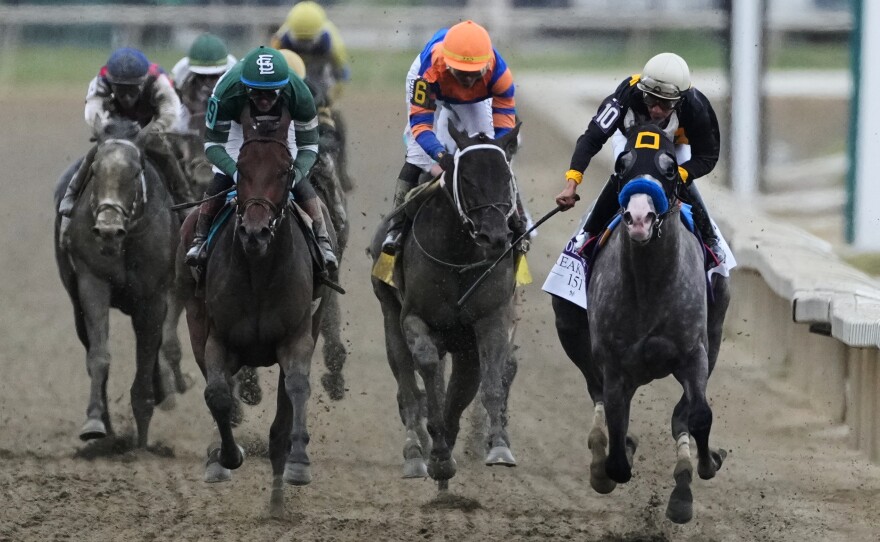 Paco Lopez, far right, atop Napoleon Solo, leads the pack to win the 151st running of the Preakness Stakes horse race, Saturday, May 16, 2026, at Laurel Park in Laurel, Md.