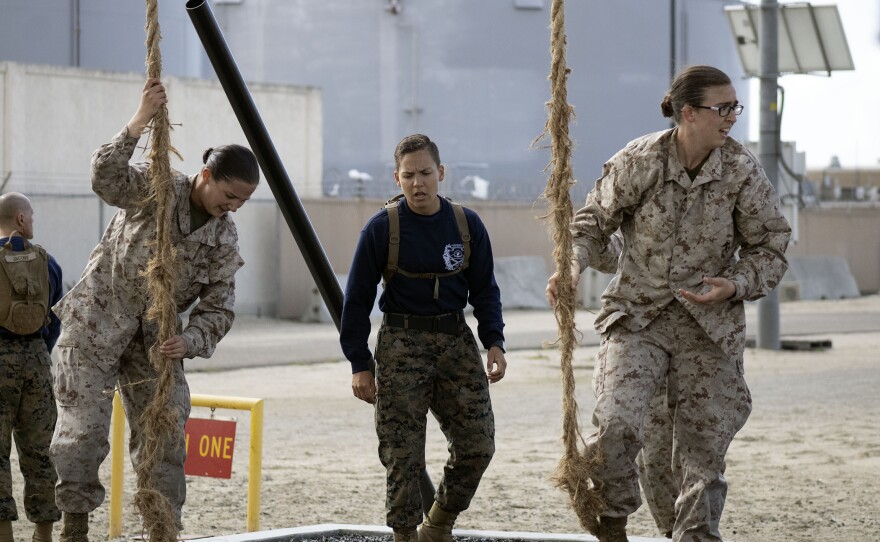 Marine recruits learn how to rope climb during the confidence course, March 9, 2021.