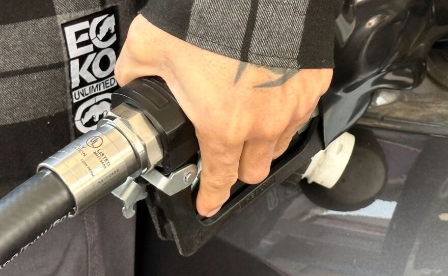 Man pumps gas at a Chula Vista Chevron station as gas prices rise on March 5, 2026.