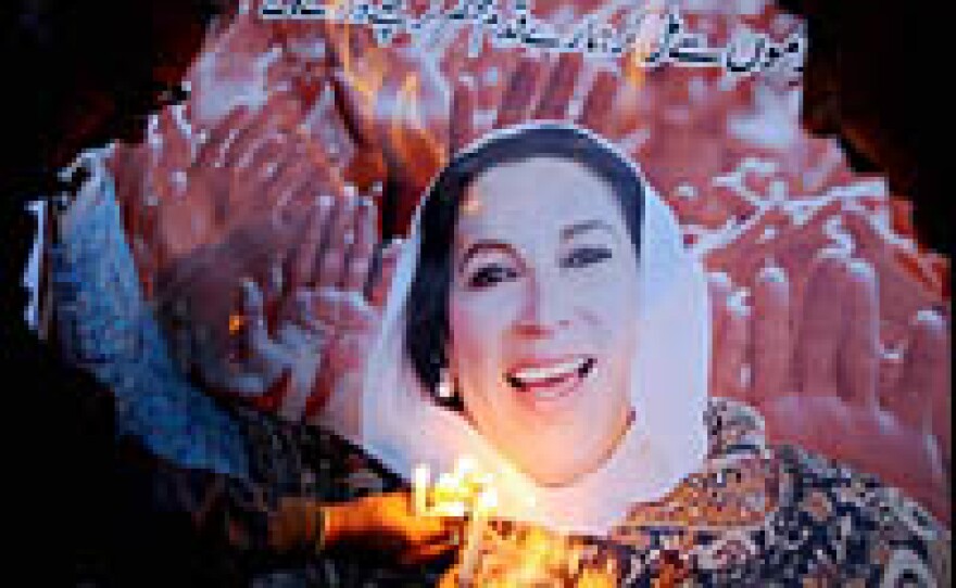 Pakistanis hold candles during a ceremony for Benazir Bhutto in Lahore, Pakistan, to mark the end of the 40-day mourning period for her on Thursday.