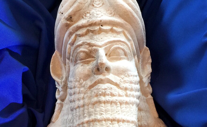 The head of a limestone statue representing Assyrian King Sargon II.