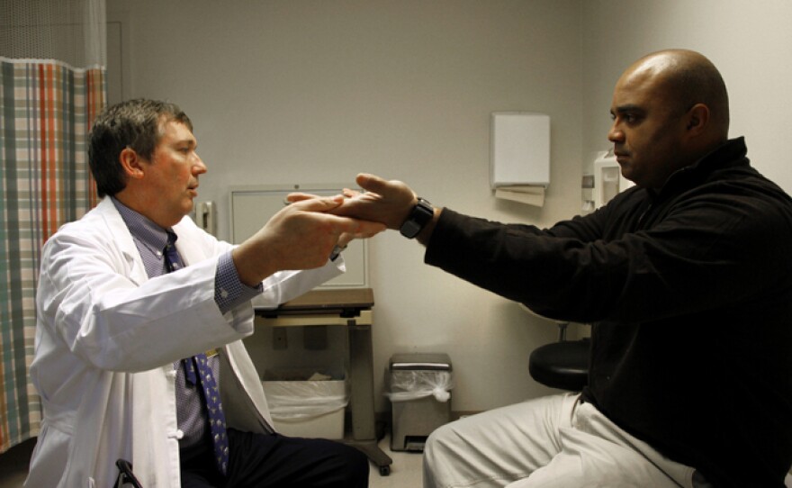 Dr. Alex Dromerick co-directs the Brain Research Center at the National Rehabilitation Hospital. Here he observes Stephen Jones, a policeman who was involved in a motorcycle accident.