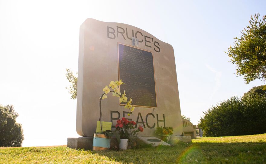 Flowers in support of the Bruce Family and George Floyd stand at Bruce's Beach in April in Manhattan Beach, California.