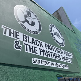 A sign on the wall at Clementine McDuff Elks Lodge showcases logos and titles for The San Diego Black Panther Party, July 28, 2026.