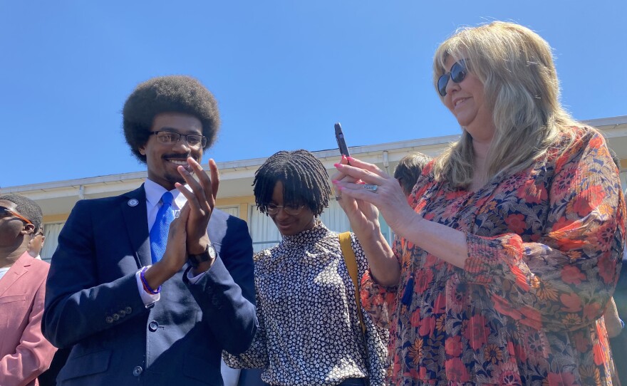 Justin J. Pearson stands with state Rep. Gloria Johnson during a rally in Memphis, Tenn., before a vote to reinstate him to the Tennessee House on April 12, 2023.