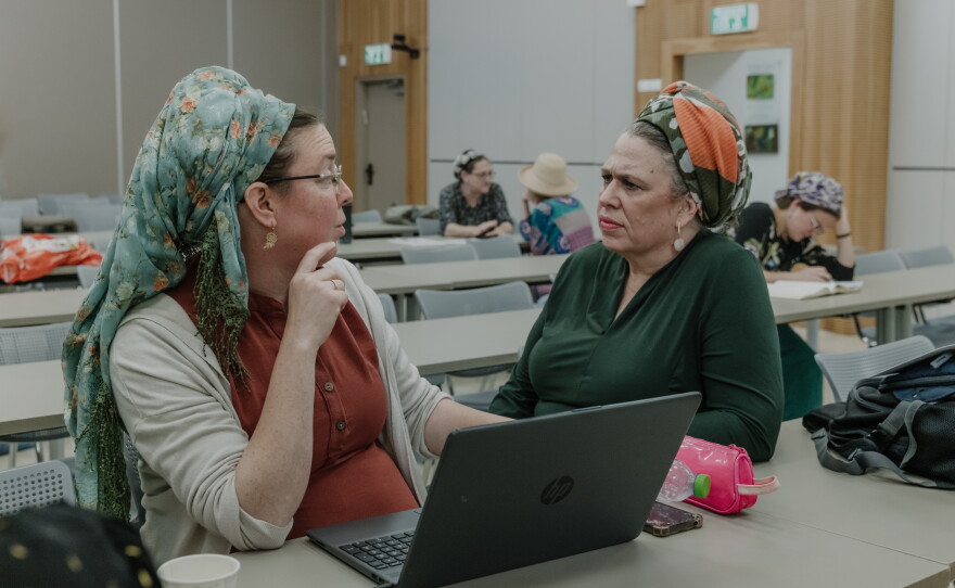 Rabbanit Batya Krauss talks with a student.