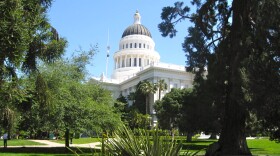 Flags lowered to half-staff above the State Capitol in Sacramento.