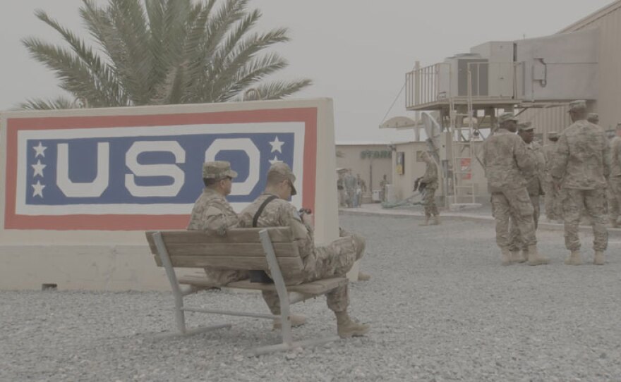 Soldiers hover outside the Camp Arifjan, Kuwait USO prior to showtime.