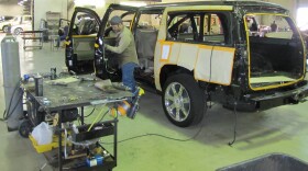 Workers at Texas Armoring Corporation fortify an SUV to withstand an attack from gunmen.