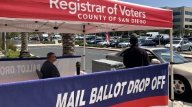 A car pulls up to a mail ballot drop off box at the San Diego County Registrar of Voters, April 5, 2022.