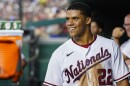 File photo of Washington Nationals' Juan Soto smiling in the dugout after a solo home run during a baseball game against the New York Mets at Nationals Park, Monday, Aug. 1, 2022, in Washington. 