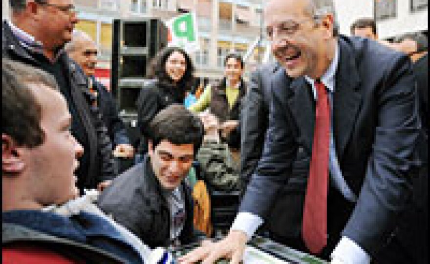 Center-left Democratic Party leader and former mayor of Rome, Walter Veltroni, jokes with supporters after a campaign rally on Tuesday in Calabria, in southern Italy.