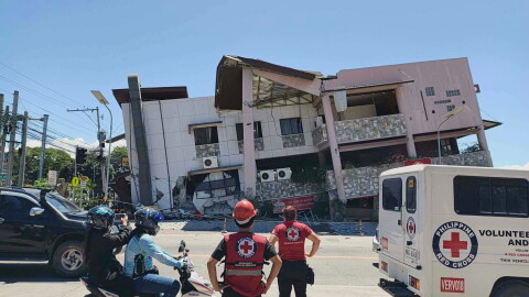 In this photo provided by the Philippine Red Cross, rescuers inspect the damage after an earthquake in General Santos, Philippines, Monday, June 8, 2026.