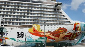 The Norwegian Gateway cruise ship is moored at PortMiami on Jan. 7 in Miami. The Centers for Disease Control and Prevention dropped its advisory warning Wednesday for cruise travel after more than two years of warning Americans.