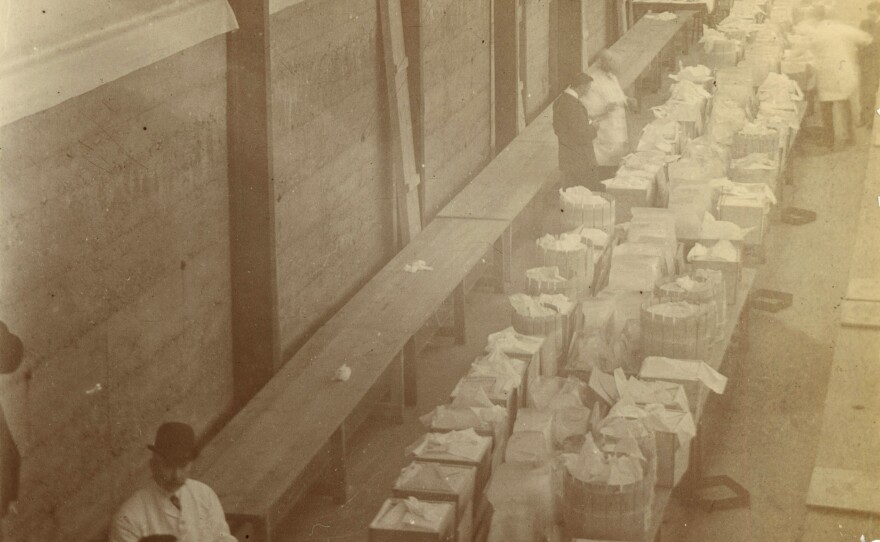 Butter is inspected inside a creamery in Dublin, Ireland, during the first quarter of the 20th century.