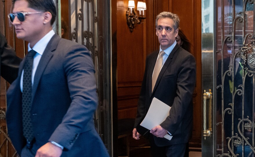 Michael Cohen leaves his apartment building on his way to Manhattan Criminal Court on Thursday.