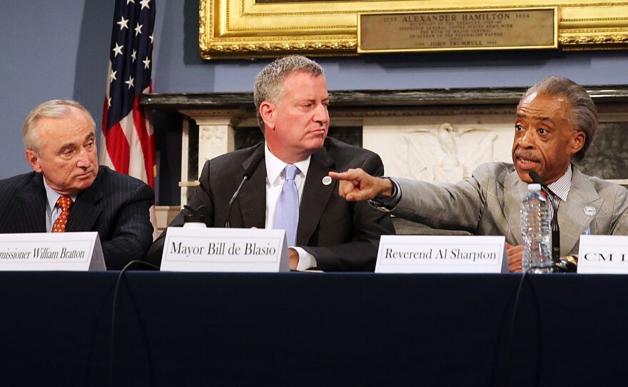 The death of Eric Garner in police custody has sparked controversy in New York City — and it's now been ruled a homicide. On Thursday, New York Mayor Bill de Blasio, center, sat with Police Commissioner Bill Bratton, left, and Rev. Al Sharpton during a discussion on police-community relations.