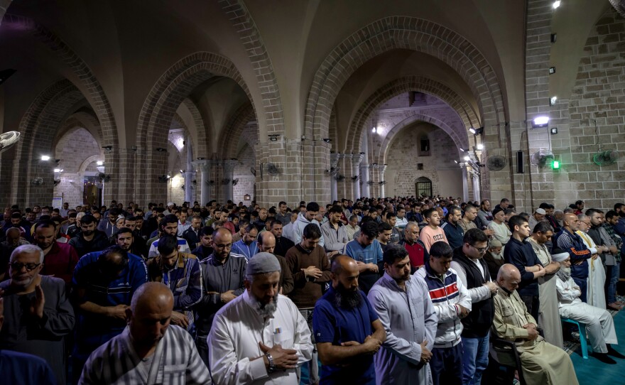 Palestinians perform the last Tarawih prayer during the holy month of Ramadan at the Omari Mosque in old Gaza on April 30, 2022 in Gaza City, Gaza.