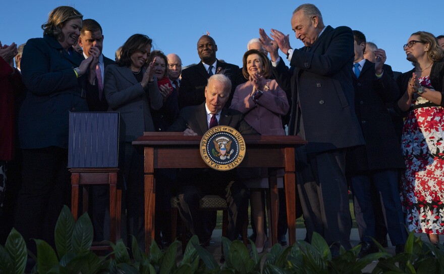 President Joe Biden signs the "Infrastructure Investment and Jobs Act" during an event on the South Lawn of the White House, Monday, Nov. 15, 2021, in Washington.