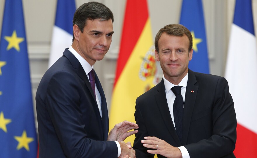 French President Emmanuel Macron (right) shakes hands with Spanish Prime Minister Pedro Sánchez after a joint press conference at the Élysée Palace in Paris on June 23.