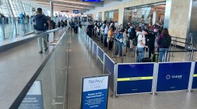 Travelers wait in line for TSA check at the San Diego International Airport's Terminal 2, Oct. 9, 2025.