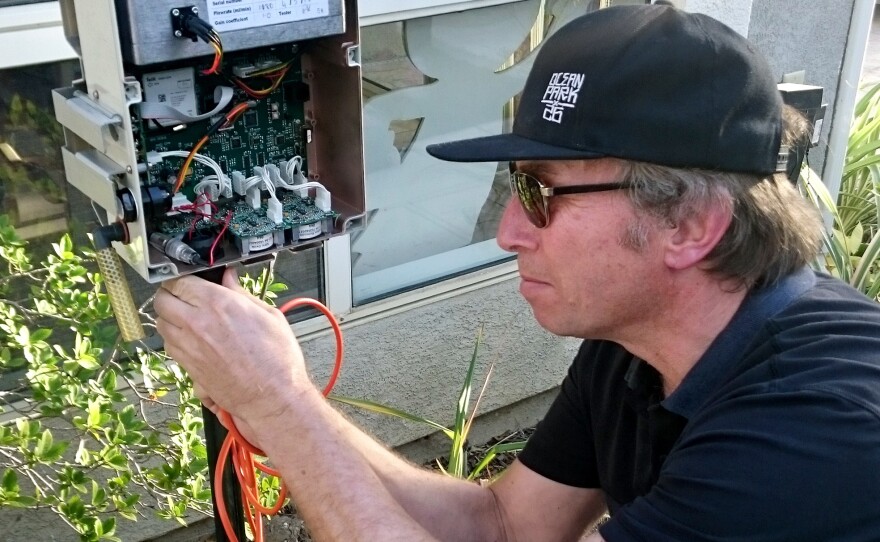 UCLA environmental health researcher Michael Jerrett checks one of the sensors he's placed throughout Porter Ranch. It's checking for a number of air contaminants, including benzene and hydrogen sulfide, as well as temperature and wind direction.