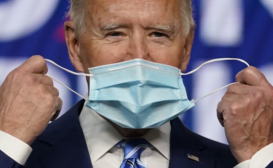 President Joe Biden, pictured on the campaign trail in Nov. 2020, has long encouraged Americans to mask up in the fight against COVID-19. On Wednesday, his administration announced it will provide 25 million masks to community health centers and food banks across the country.