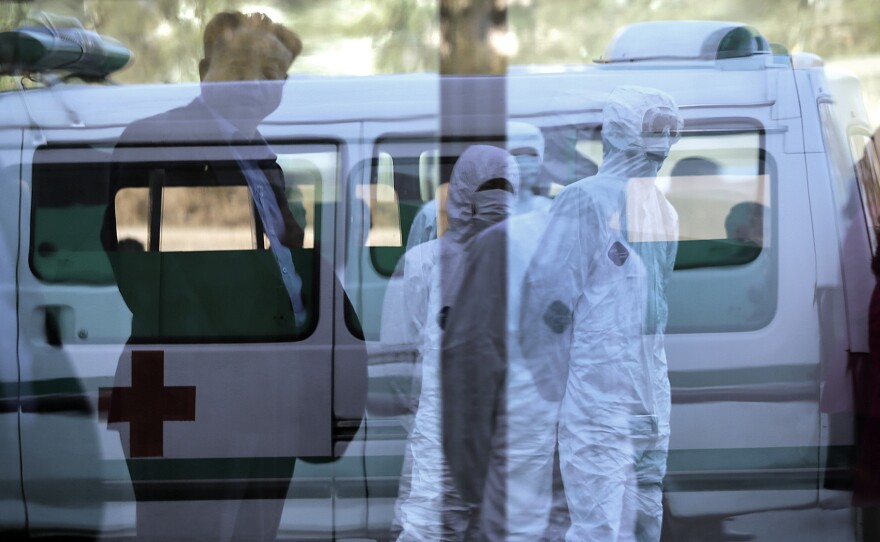 North Korean medical workers wore protective suits at Pyongyang's Sunan International Airport this week.