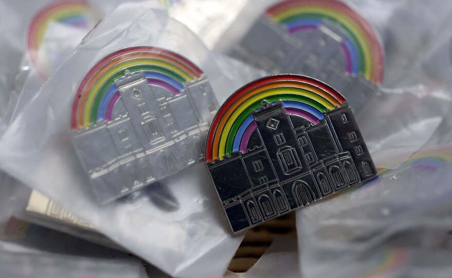 The LGBTQ+ rainbow is pictured above a mini version of Powderham Castle on a badge in Devon, Britain, July 21st 2025.