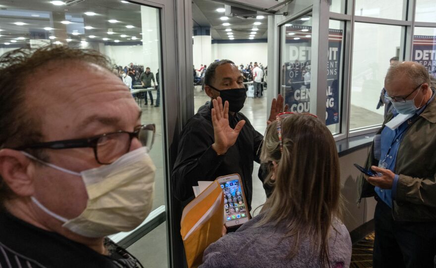 Supporters of US President Donald Trump try to enter the room where absentee ballots for the 2020 general election are being counted at TCF Center on November 4 in Detroit.