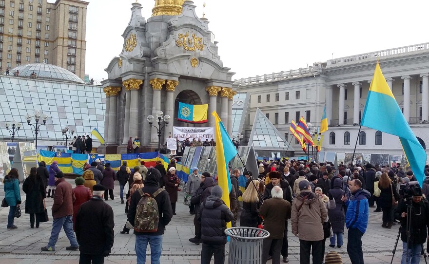 Crowds gather in Maidan at the foot of Kiev's monument to Ukrainian independence.