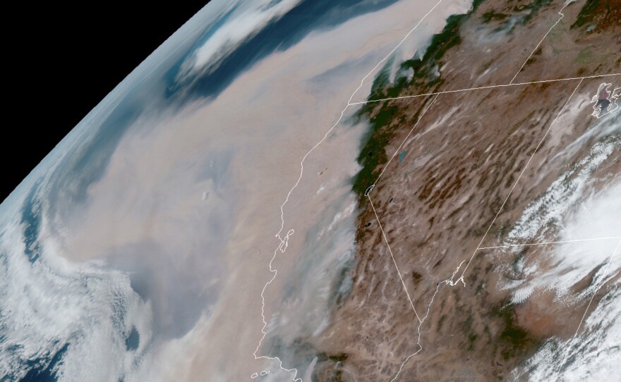 Brown smoke from wildfires blows westward in the atmosphere from California and Oregon on Sept. 9, 2020. Smoke from Western fires has triggered air quality alerts 3,000 miles away.