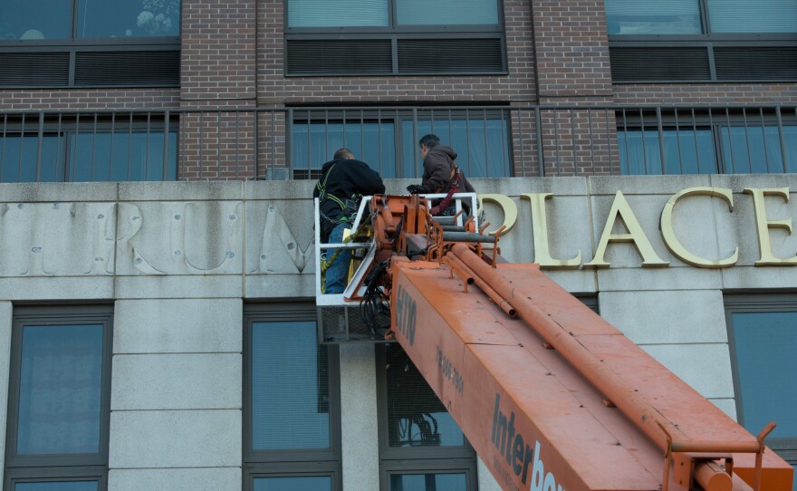Workers remove Trump signage from Trump Place on Riverside Boulevard. on Manhattan's West Side on Nov. 16, 2016. A separate building nearby has asked for permission to remove Trump's name.