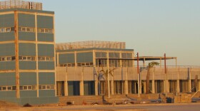 The buildings at the marina at Santa Rosalillita at sunset: they are rusting away.