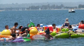 People float on rafts and drink on Sail Bay in Pacific Beach during a Floatopia event on July 17, 2010. The San Diego City Council has since banned the events. But organizers believe they've found a loophole in the law.