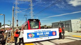 Metropolitan Transit District officials and employees are shown unveiling the low-floor trolley on Jan. 27, 2015. 