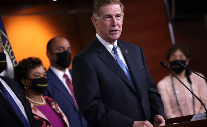 Rep. Don Beyer, D-Va., shown here at a news conference this year, introduced the Safe Travel Act on Sept. 9 because he thinks President Biden's vaccine mandate doesn't go far enough.