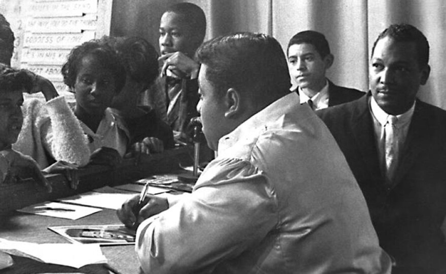 Billy Stewart (right) signs autographs for teenagers on the television dance show for Black teens in Washington, DC. "The Teenarama Dance Party."