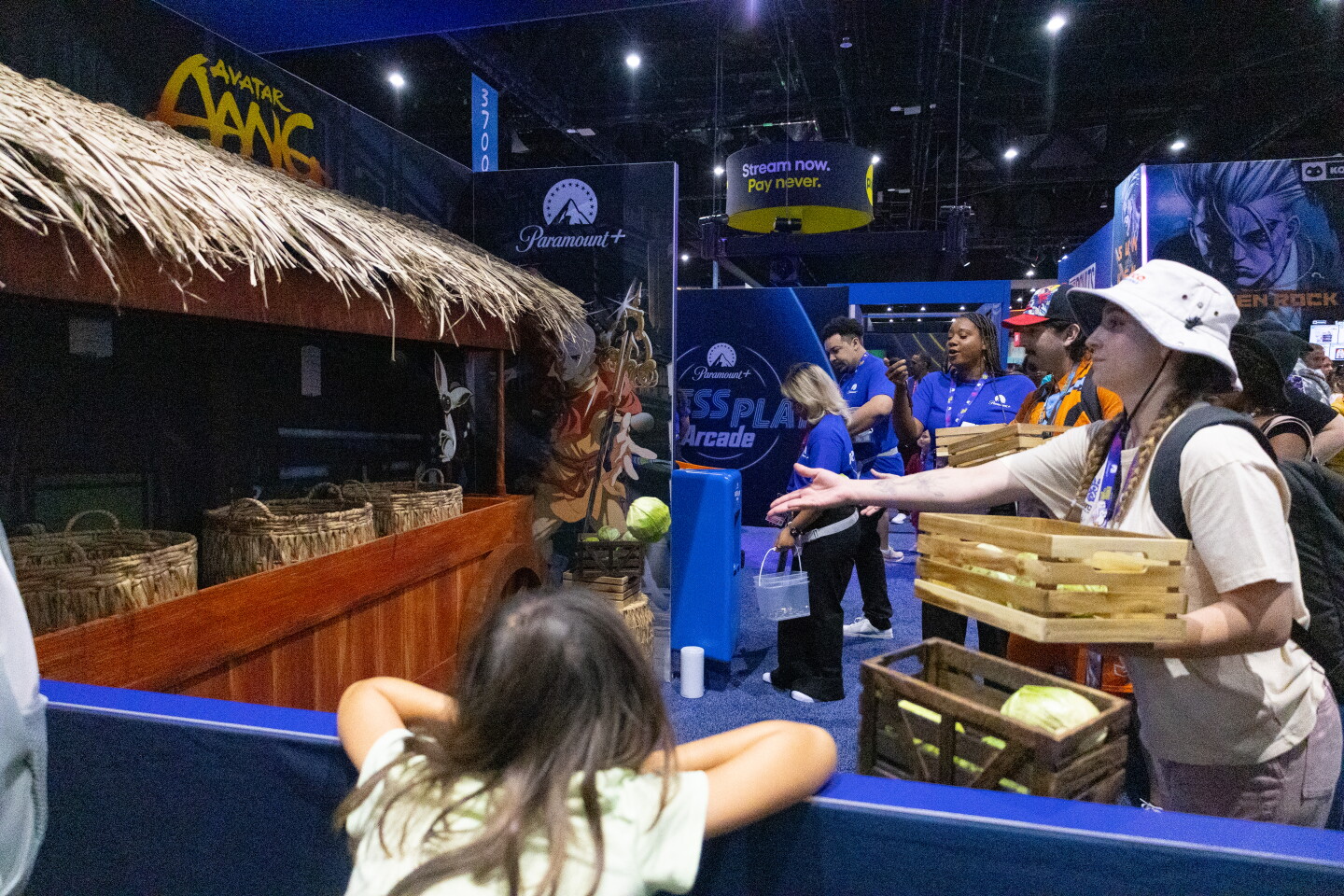 Attendee throws rubber cabbages in a game pop-up during Comic-Con, April 23, 2026.
