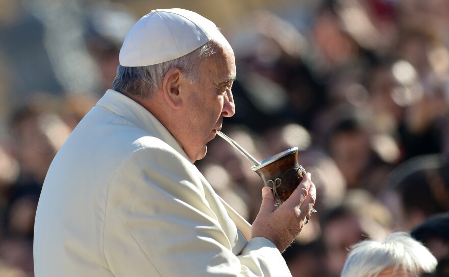 Pope Francis sips his mate as he arrives for his general audience at St. Peter's Square in December.