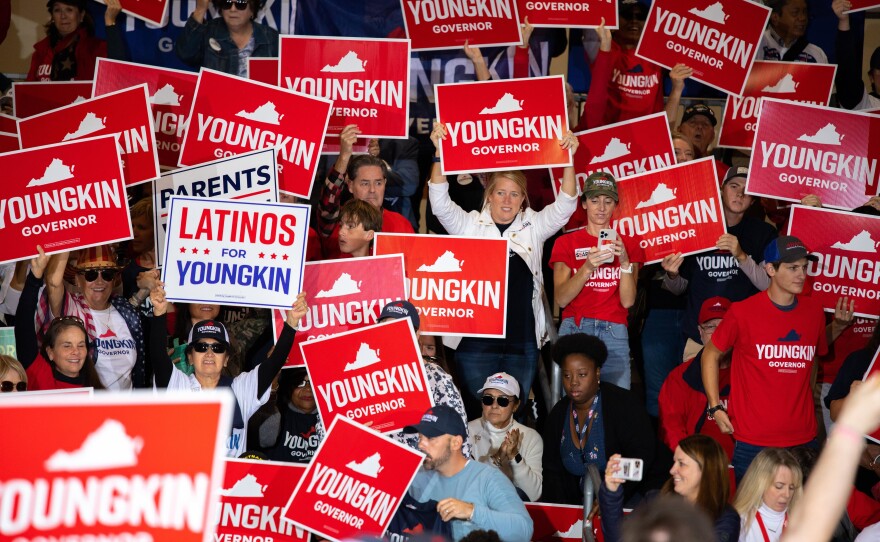 The day before the election for governor in Virginia, Glenn Youngkin supporters gather inside an airplane hanger in Chesterfield County to show their enthusiasm for the Republican candidate.