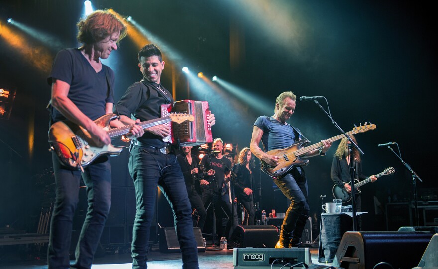 Sting (center), with band and vocalists, at the Olympia Paris in April 13, 2017.