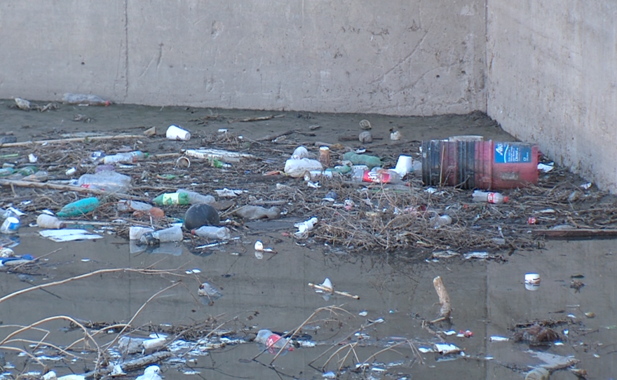 Trash fills up a settling tank in Tijuana's Cañon de la Pedrera, Dec. 2, 2015. 