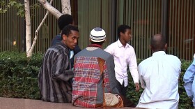 People wait outside of a federal courthouse before a hearing for three men suspected of aiding a Somali terrorist organization, November 9, 2010 in San Diego, Calif.